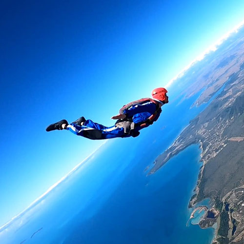 AFF skydiving student flying over Airlie Beach coastline