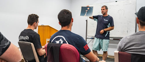Students doing AFF Skydiving Ground Course in a classroom
