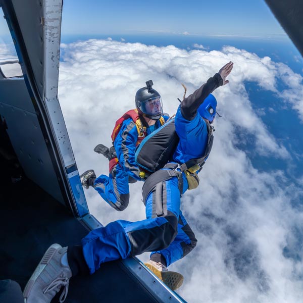Skydiving instructor and AFF student exiting plane over Moruya NSW