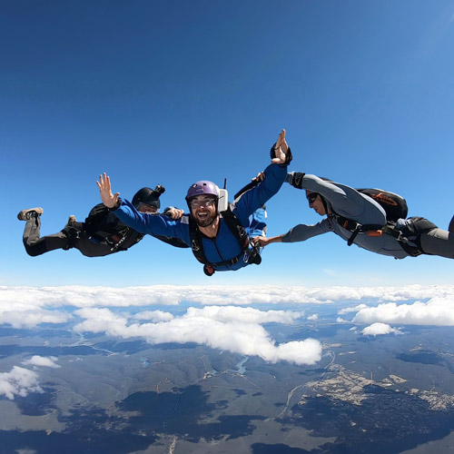 Skydiving student doing AFF stage 1 with two instructors in Sydney