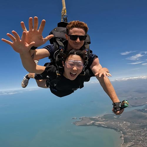 tandem skydiving passenger and instructor over airlie beach