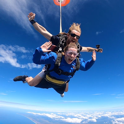 Skydiving instructor and passenger in freefall tandem skydiving