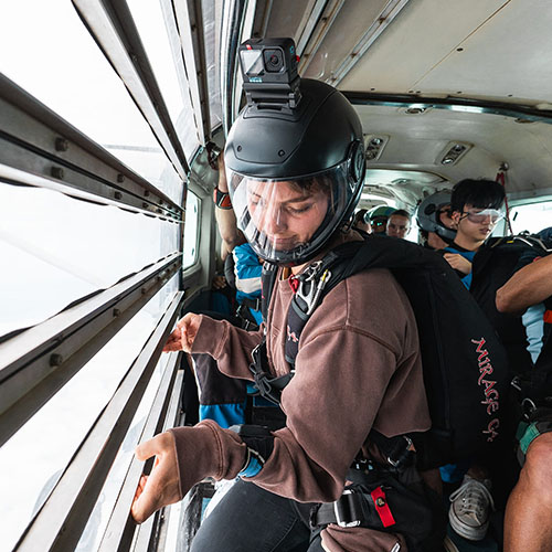 Licensed skydiver opening the door of the plane