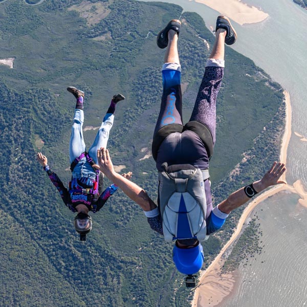 Licensed skydivers flying angles discipline over Airlie Beach Queensland Australia