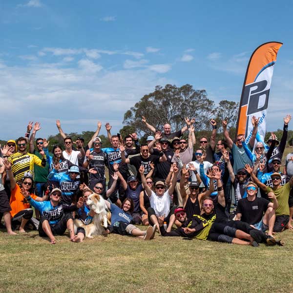 Licensed skydivers posing for a group photo after the Pond Froth swooping event