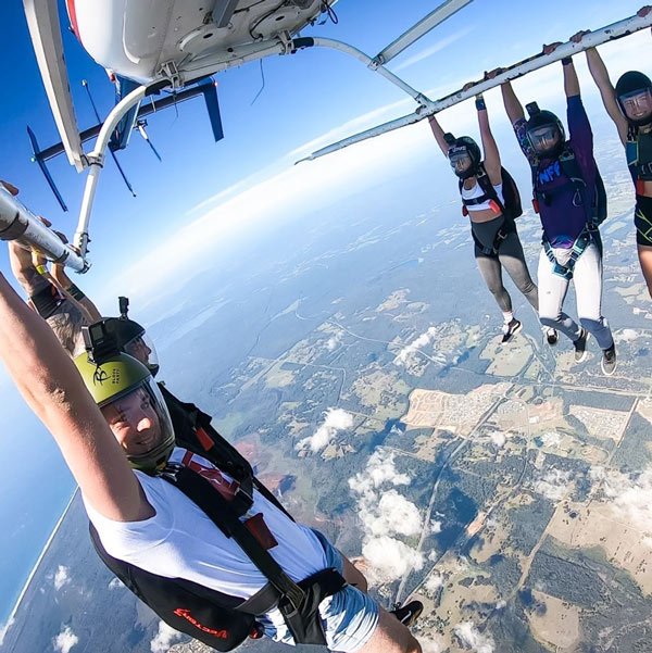 Licensed skydivers fun jumpers skydiving from a helicopter in Port Macquarie NSW Australia