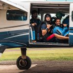 Skydiving instructor and tandem passenger boarding the plane prior to take off