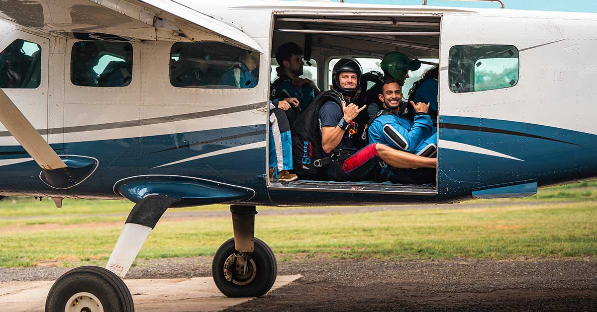 Skydiving instructor and tandem passenger boarding the plane prior to take off