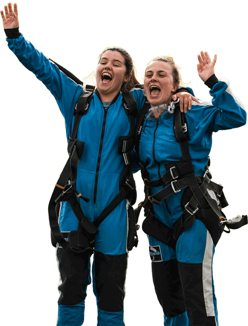 Skydiving passengers celebrating after their skydive