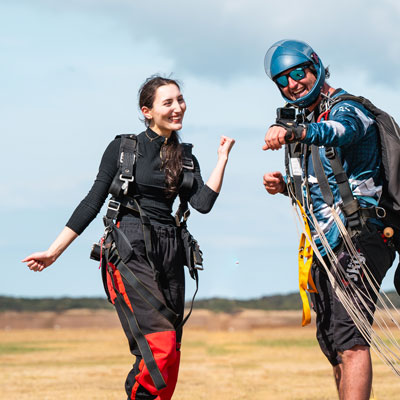 Skydiving student posing for a photo with skydiving instructor