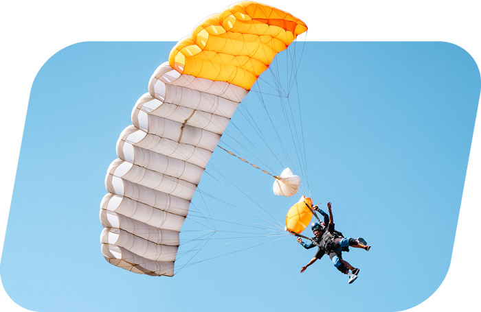 passenger and skydiving instructor flying a parachute