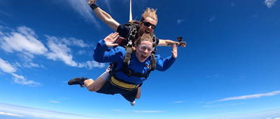 Skydiving instructor and passenger in freefall over the Sunshine Coast