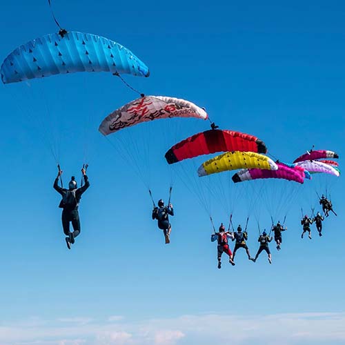 Skydivers flying parachutes in Melbourne