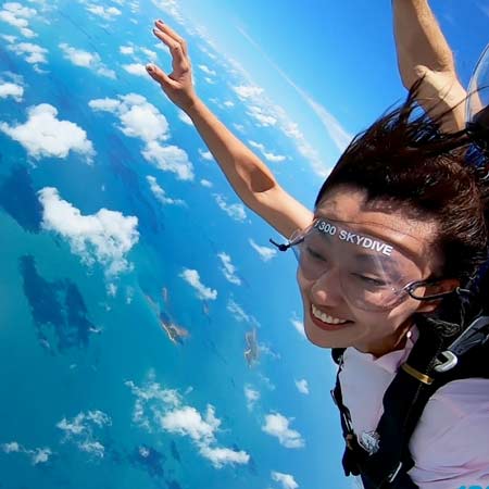 skydiving customer in freefall over Cairns Great Barrier Reef