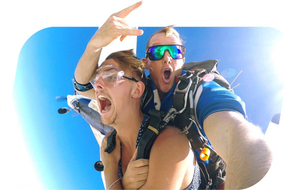skydiving cairns instructor and passenger exiting plane