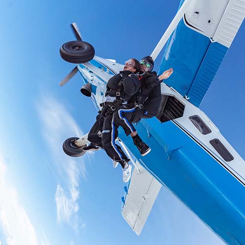 Tandem skydiving experience from aircraft over Moruya, capturing thrilling exit moment