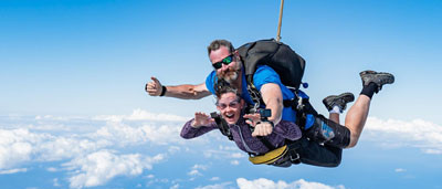 Tandem skydiving instructor and passenger in freefall