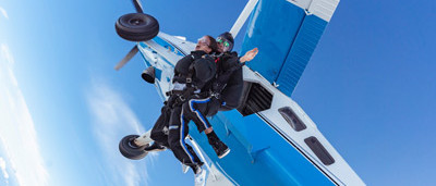 tandem skydiving pair exiting plane over Moruya Heads Batemans Bay