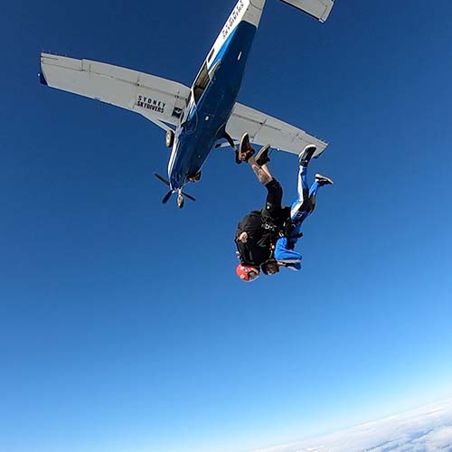 Sydney skydiving pair exiting plane