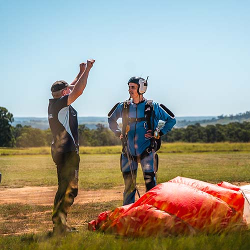 skydiving student listening to instructor instructions