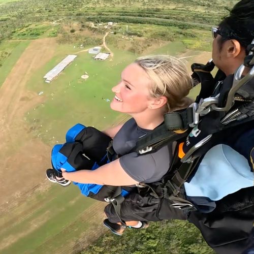 Tandem pair skydiving in Townsville getting ready for landing